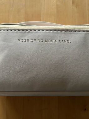 “Rose of No Man's Land” Cream Leather Toiletry Bag